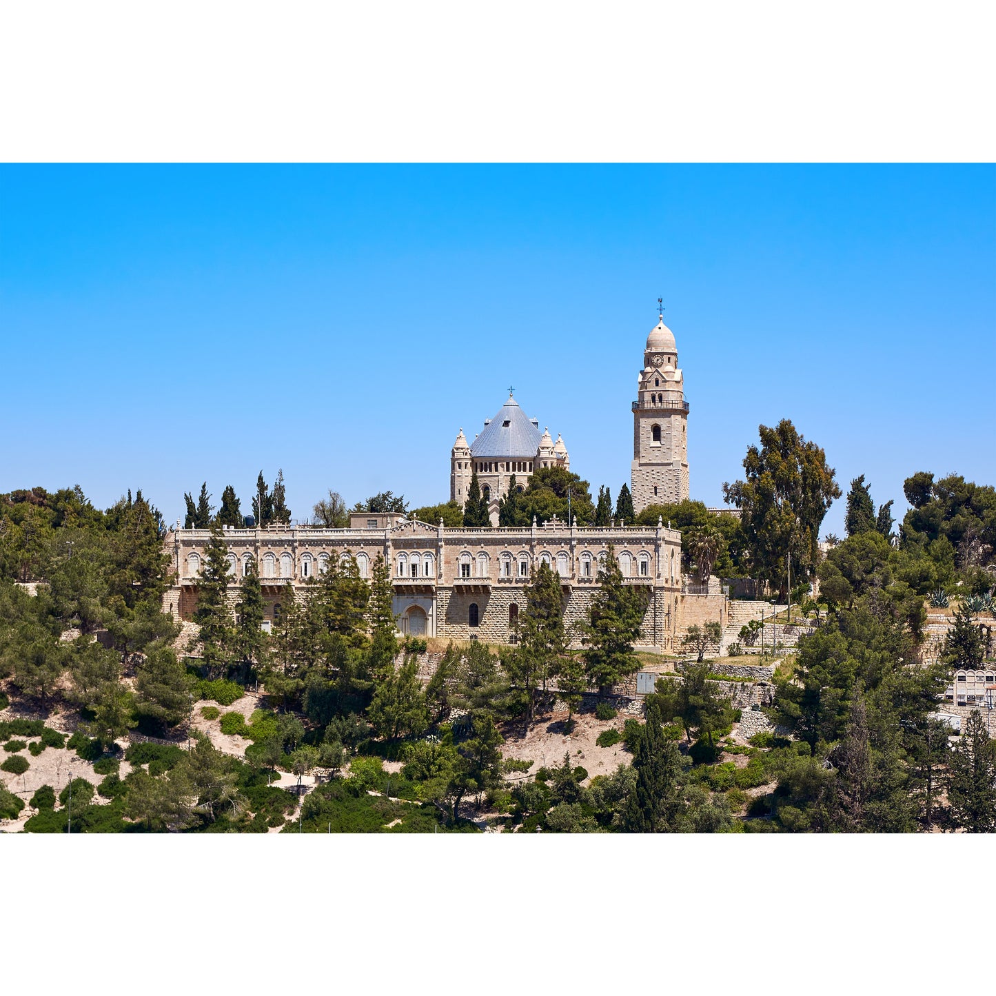 Dormition Abbey on Mount Zion in Jerusalem exterior view of the church
Interior of Dormition Abbey in Jerusalem with candles lit for prayer