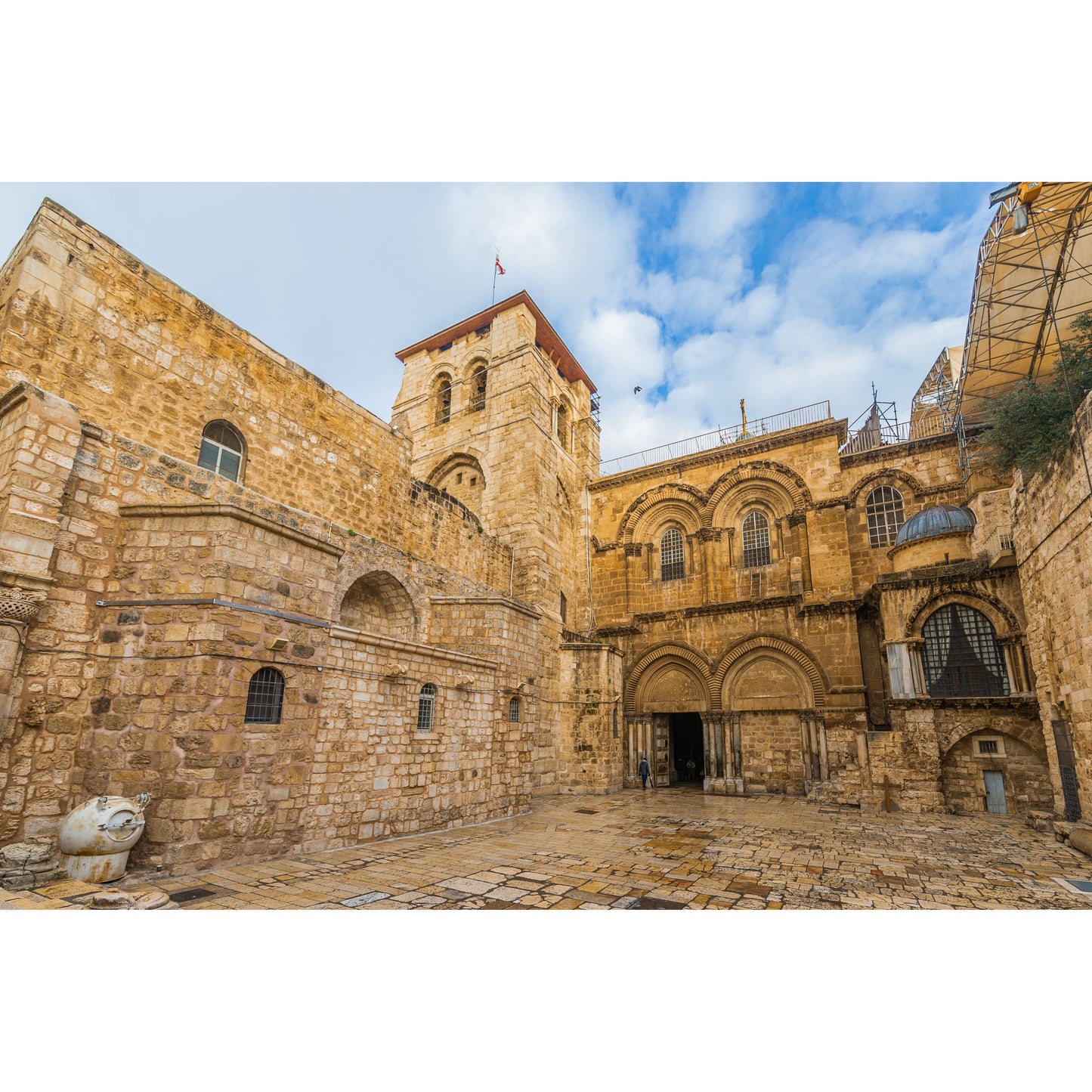 Church of the Holy Sepulchre in Jerusalem exterior courtyard

Candle lit inside the Church of the Holy Sepulchre during prayer