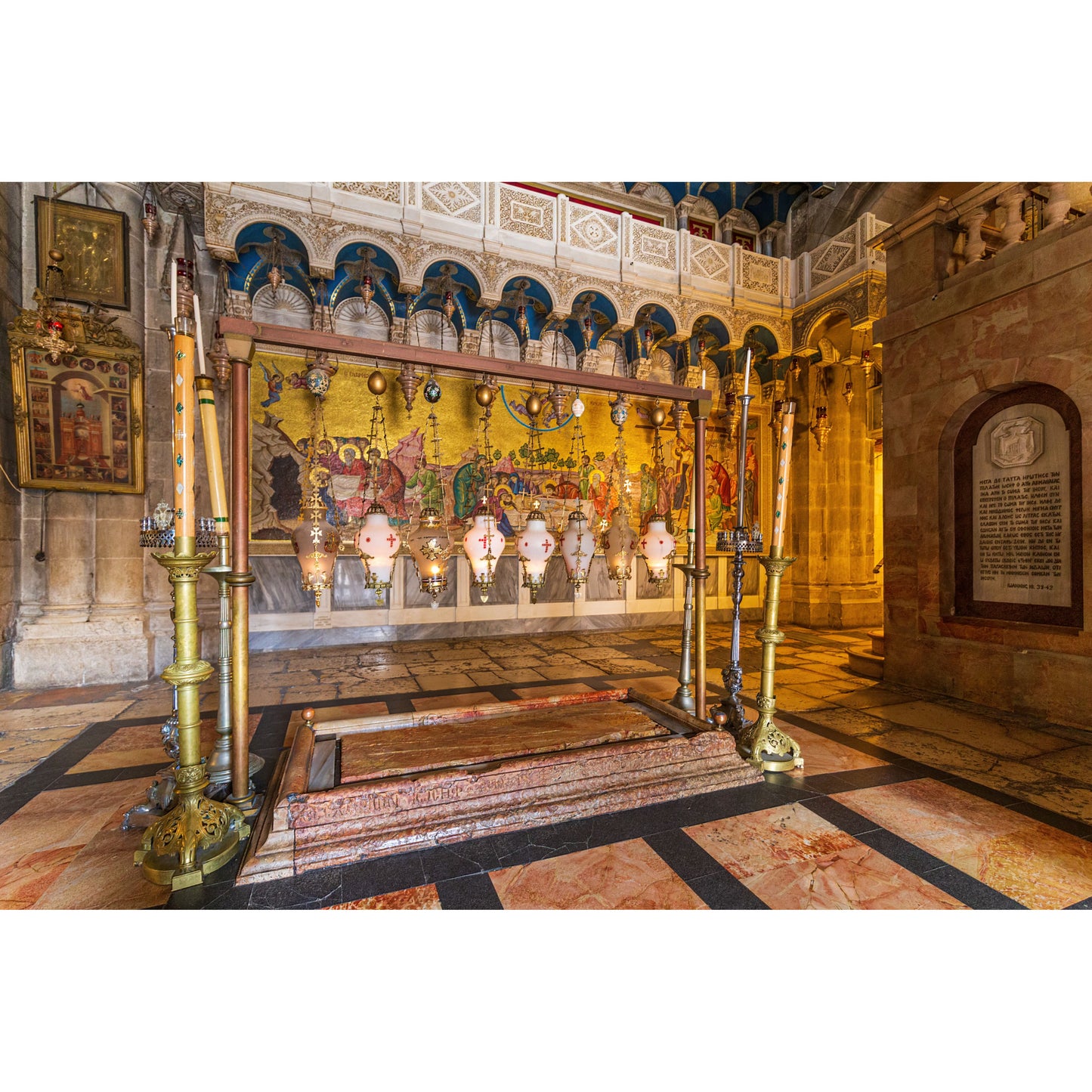Stone of Anointing inside the Church of the Holy Sepulchre in Jerusalem close-up

Pilgrim lighting a candle near the Stone of Anointing during prayer