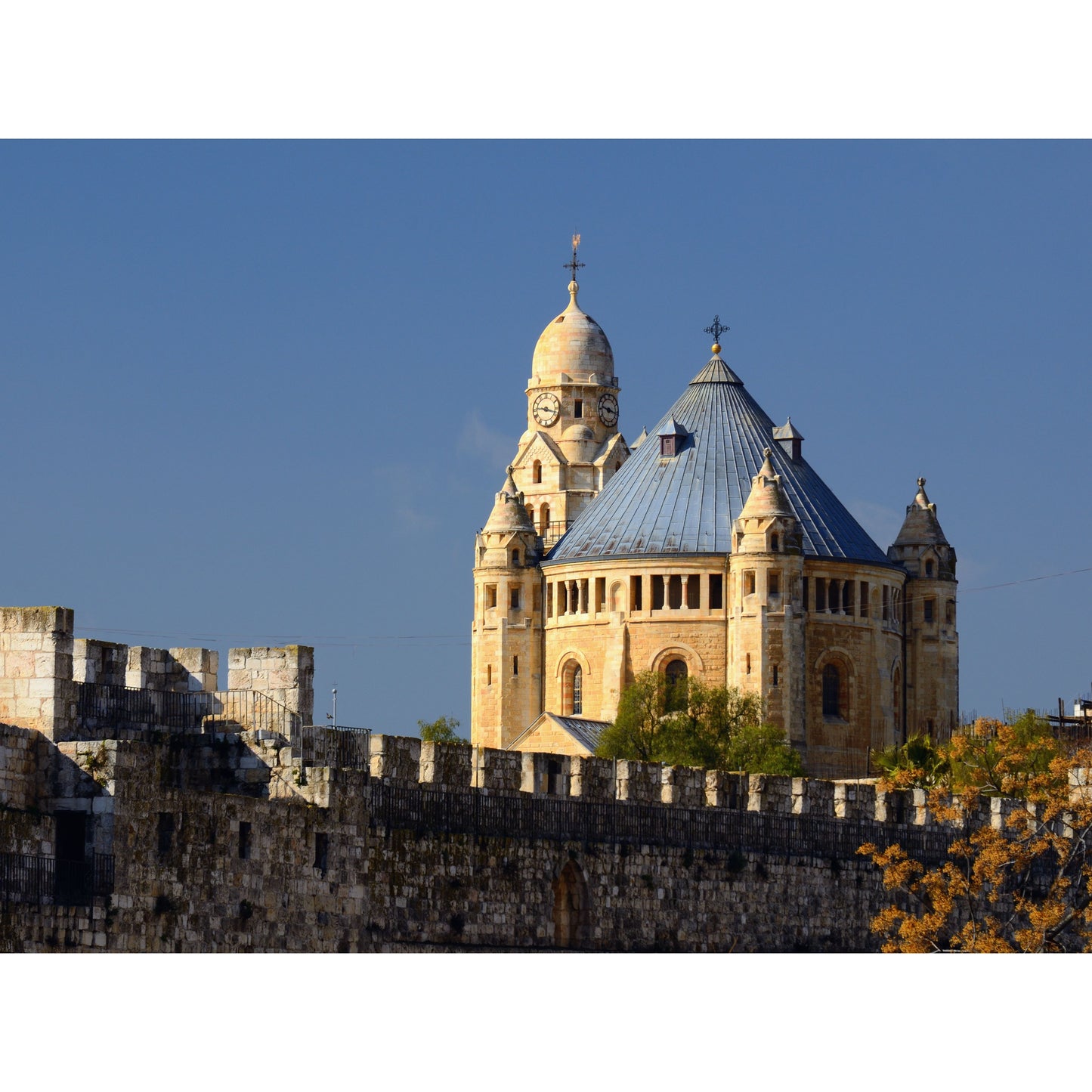 Dormition Abbey on Mount Zion in Jerusalem exterior view of the church

Interior of Dormition Abbey in Jerusalem with candles lit for prayer
