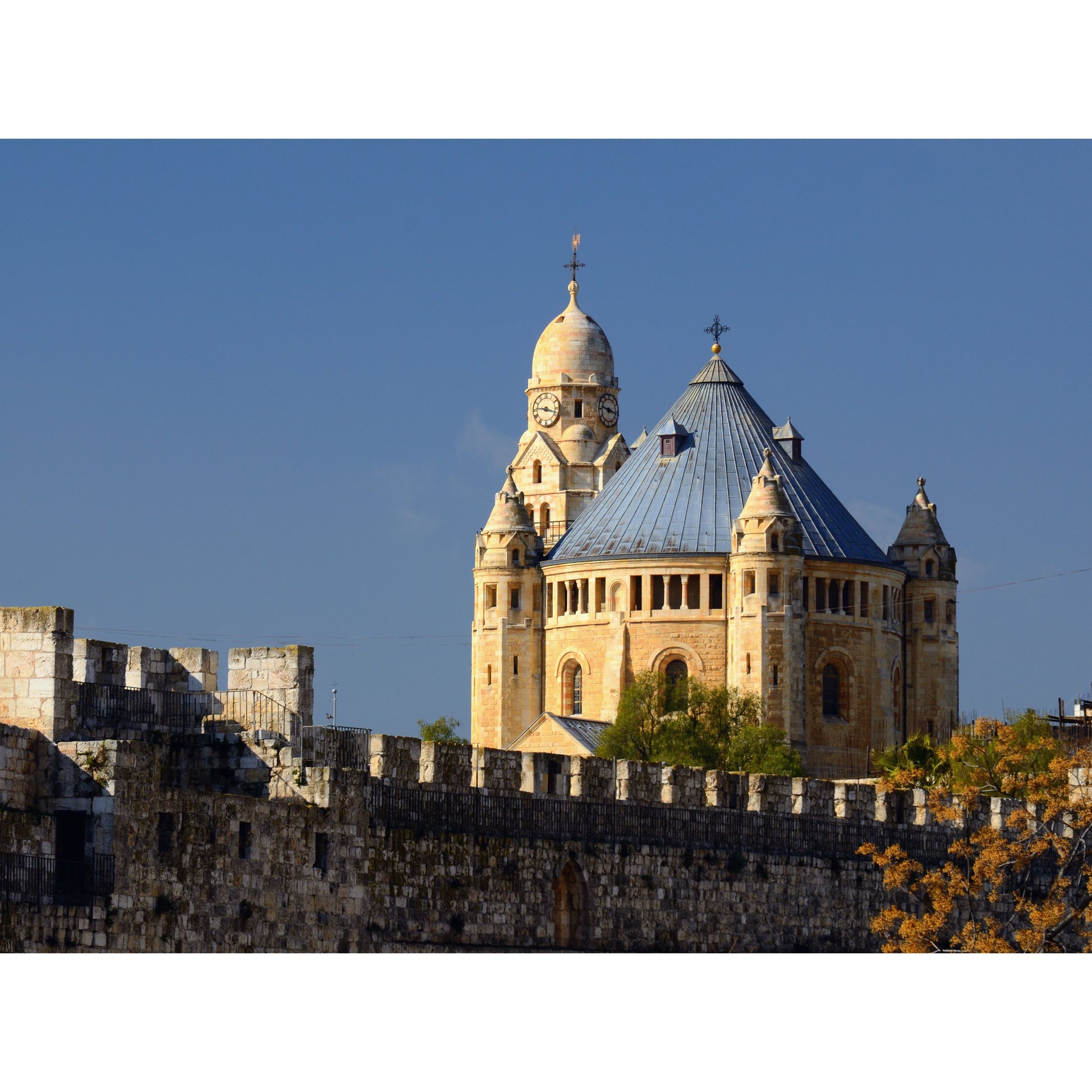 Dormition Abbey on Mount Zion in Jerusalem exterior view of the church

Interior of Dormition Abbey in Jerusalem with candles lit for prayer